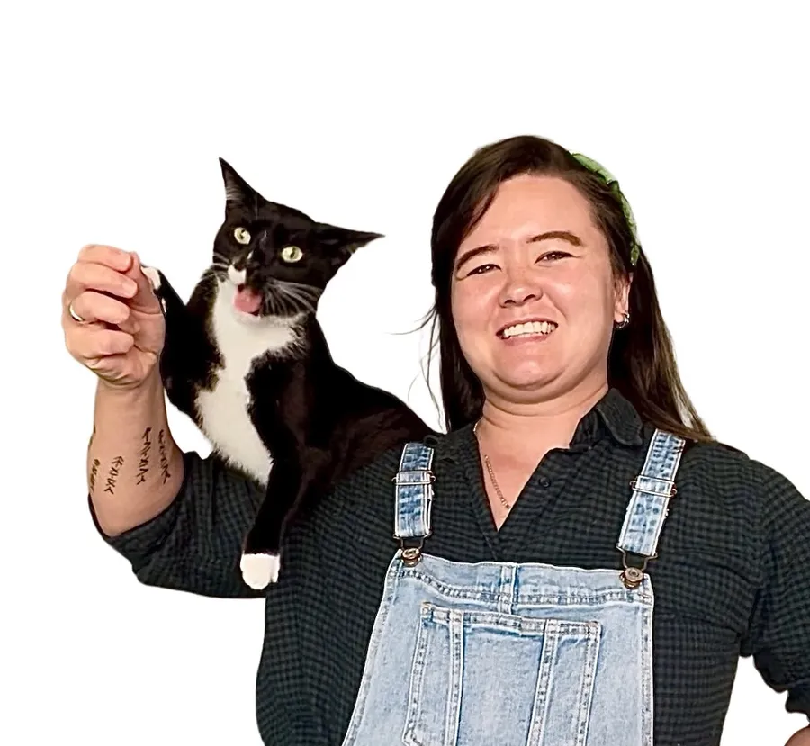 Rebekah with Monsieur Chevalier, her tuxedo cat, on her shoulder